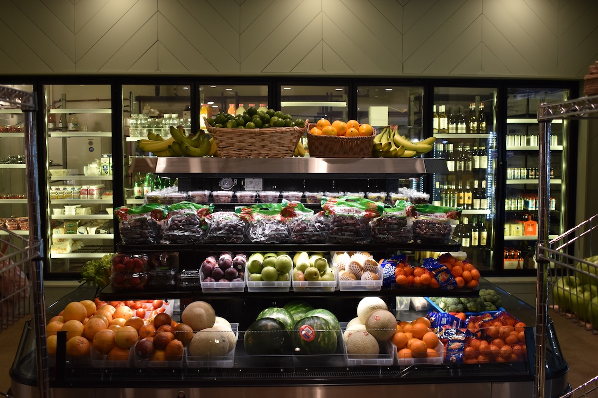 Fresh fruit and gourmet grocery display inside Ari’s Pantry Italian market in Coppell, Texas